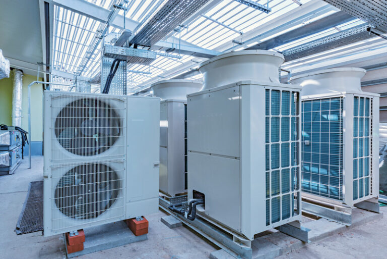 Air conditioning system assembled and installed on top of the building.